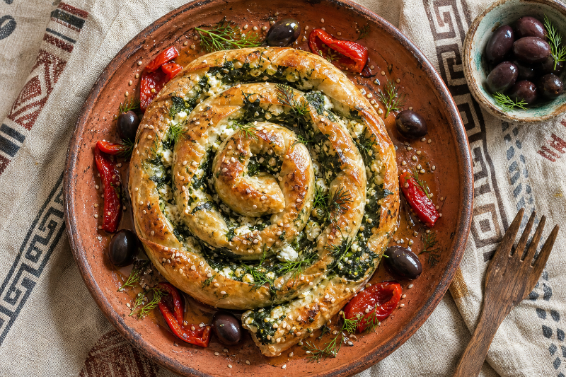 Spiral puff pastry snake filled with spinach and feta
